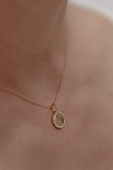 Talisman | necklace with round pendant and white topazes